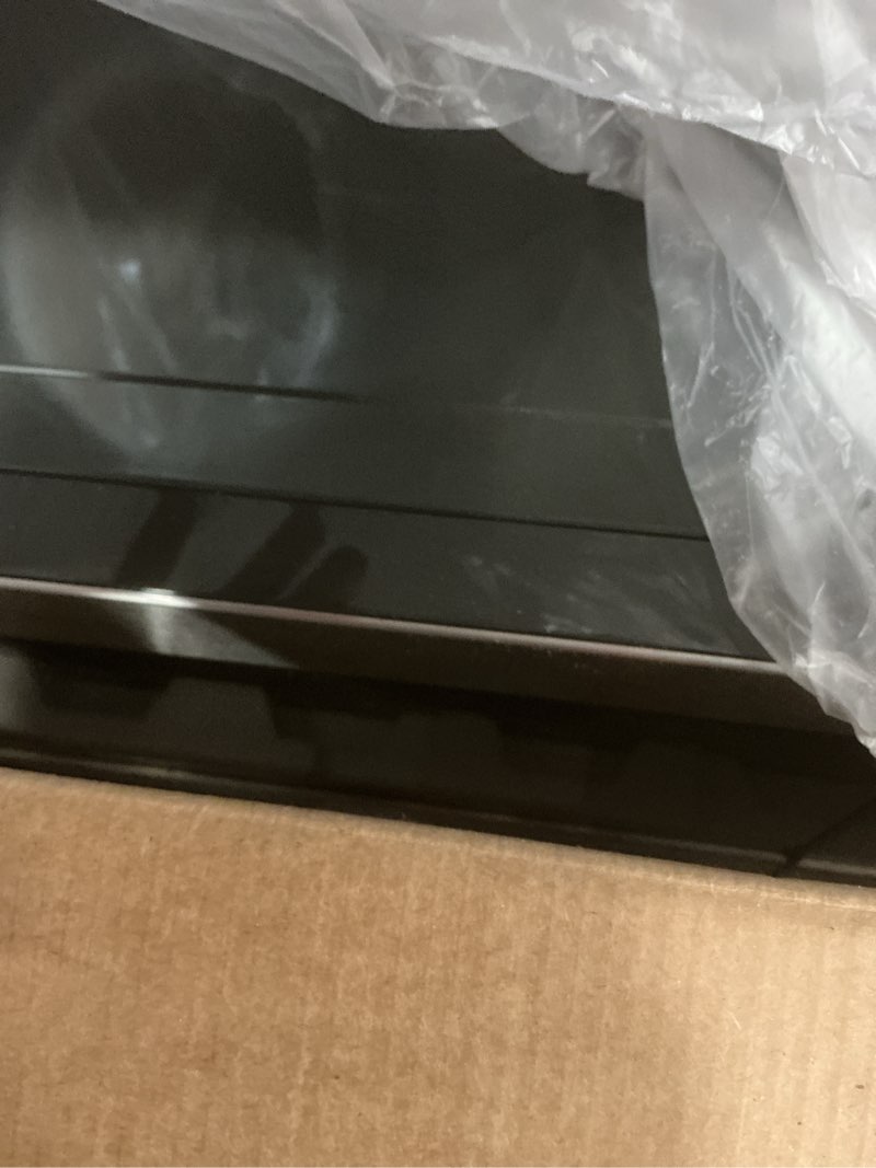 Condition photo showing Good Condition for ge compact countertop microwave oven, 0.7 cubic ft., 700-watt capacity, 6 auto cooking settings, child-lock technology, dorm room or apartment, stainless steel 0.7 cu.ft. stainless steel