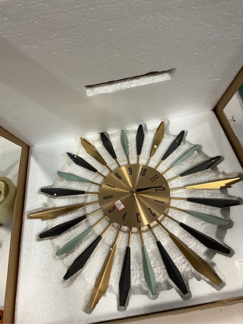 Condition photo showing Good Condition for YISITEONE Large Wall Clock Metal Decorative, Mid Century Silent Non-Ticking Big Clocks, Modern Home Decorations for Living Room,Bedroom,Dining Room, Office, 22 inch Medium 1.modern