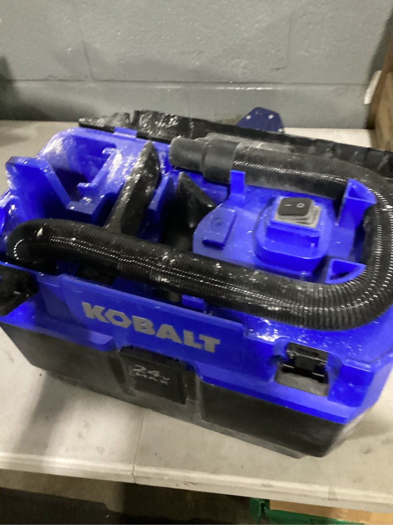Condition photo showing As Is for kobalt 24-volt 3-gallon 1-hp cordless wet/dry shop vacuum with accessories included and battery not included