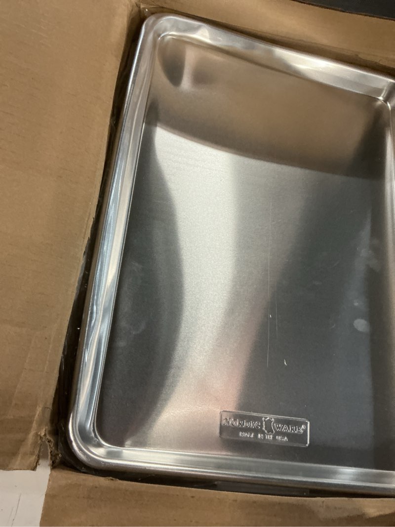 Condition photo showing As Is for Nordic Ware Naturals Half Sheet Set - USA Made Aluminum Commercial Quality Sheet Pan for Baking or Roasting, Encapsulated Galvanized Steel Rim Prevents Warping, 2pk Half + Lid