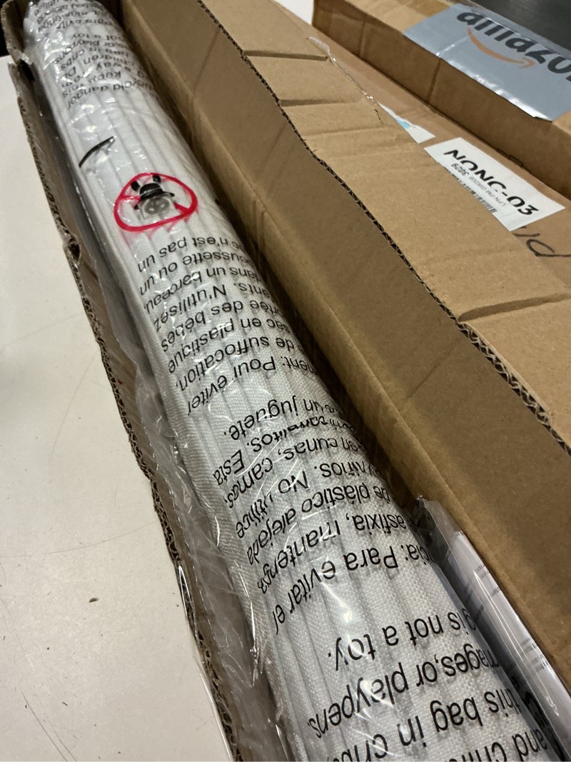Condition photo showing Good Condition for unishades no drill cordless roman shades for windows, 26" w × 64" h - 100% blackout - linen - mist white 100% blackout linen white 26" w × 64" h