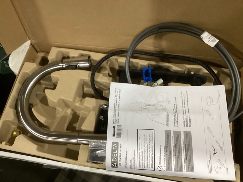 Condition photo showing As Is for delta modern brushed nickel single hole bar sink faucet, single handle prep sink faucet, spotshield stainless 14882lf-sp