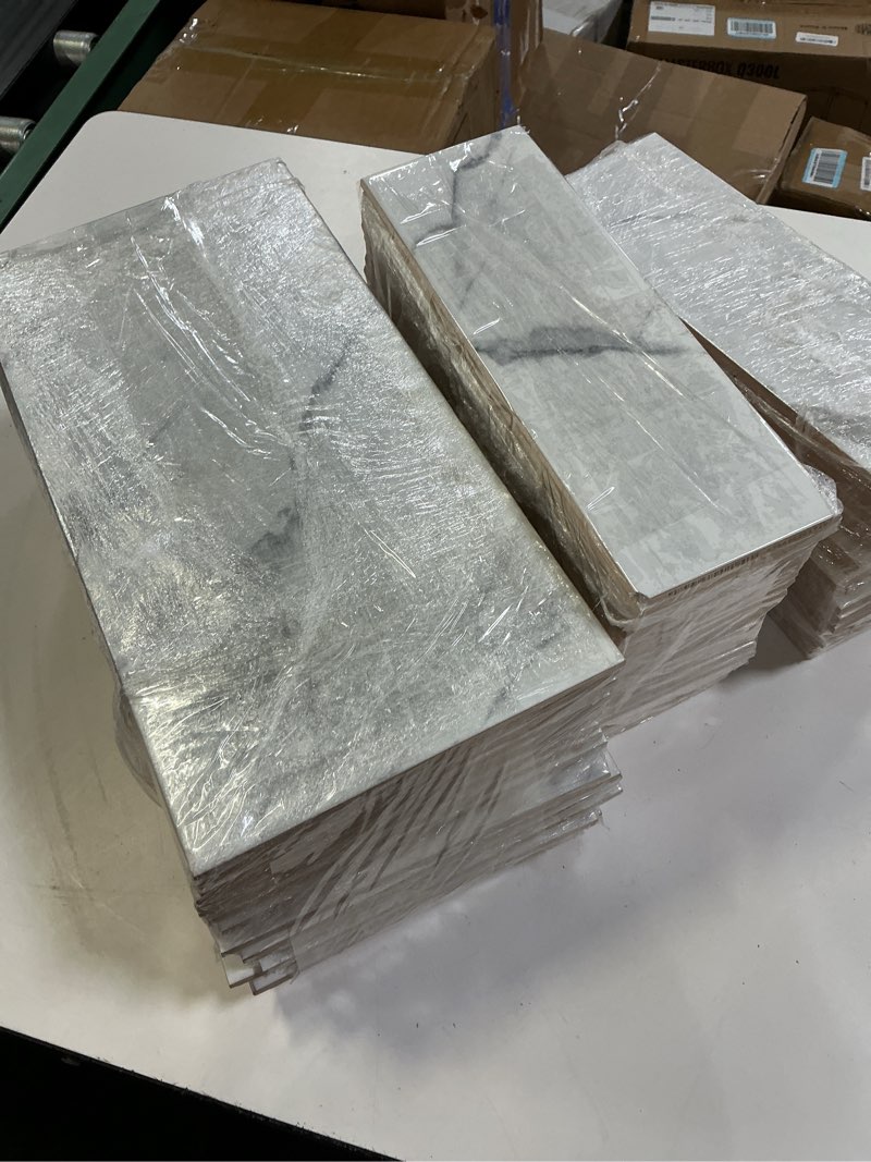 Condition photo showing As Is for assorted of apollo tile white matte porcelain marble look floor and wall tile (48pcs-size-12x4)(20pcs-size-16x8)