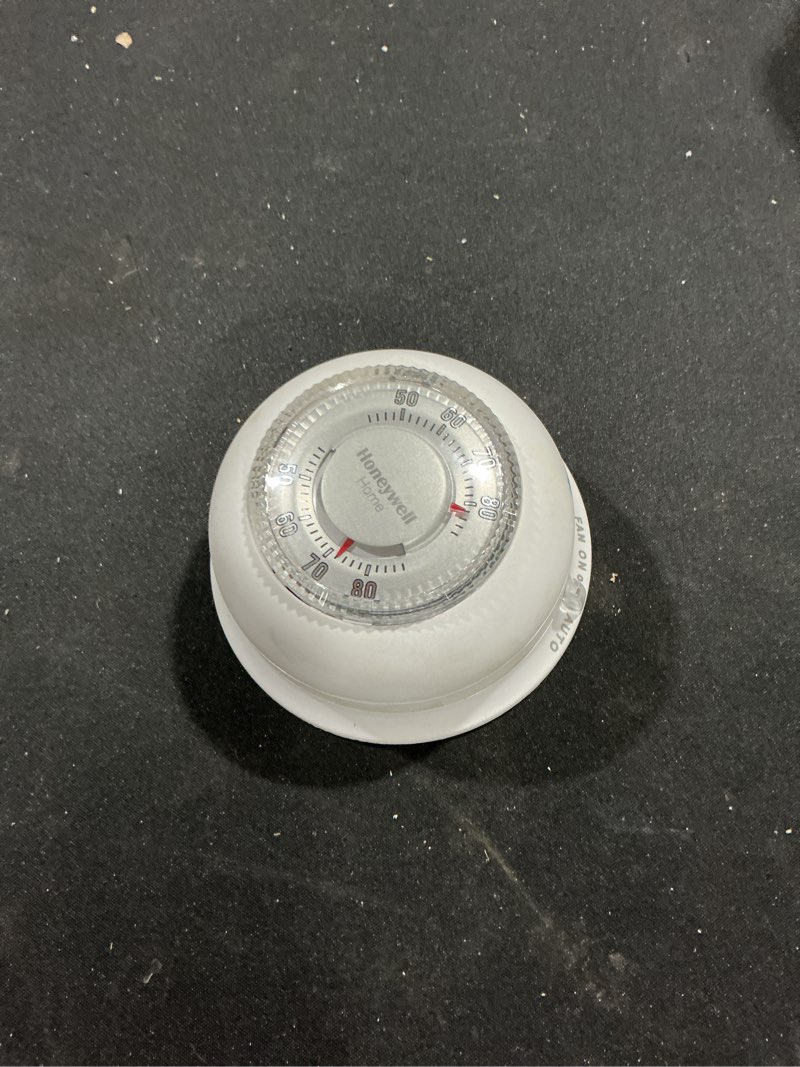 Condition photo showing As Is for Honeywell Home CT87N1001 The Round Non-Programmable Manual Thermostat, Large, White