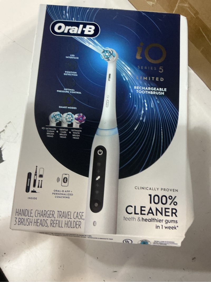 Condition photo showing As Is for oral-b io deep clean + whiten rechargeable electric toothbrush with visible pressure sensor, 2 minute timer, 5 cleaning settings, 1 io5 limited, 3 toothbrush heads, travel case & refill holder, white white 1 count (pack of 1)