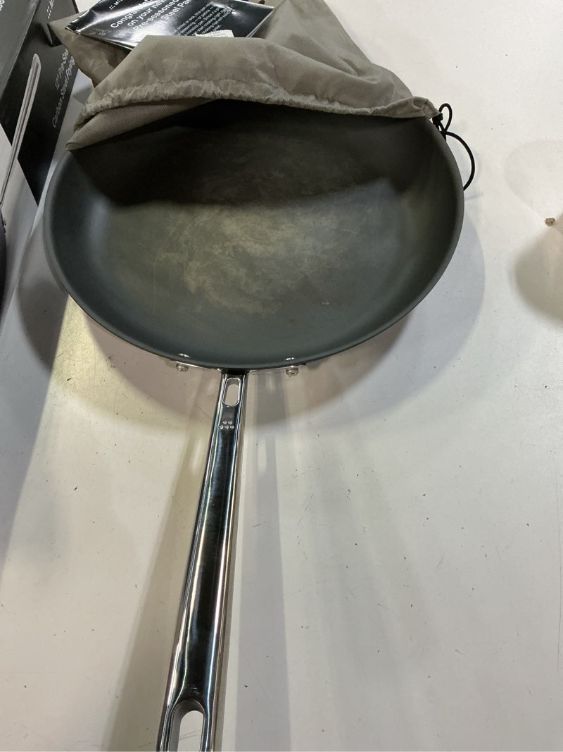 Condition photo showing As Is for misen 12 inch pre-seasoned carbon steel fry pan – lightweight, even heating, heat retention – oven safe to 500°f – ideal for searing, sautéing, and frying – versatile durable, easy to clean