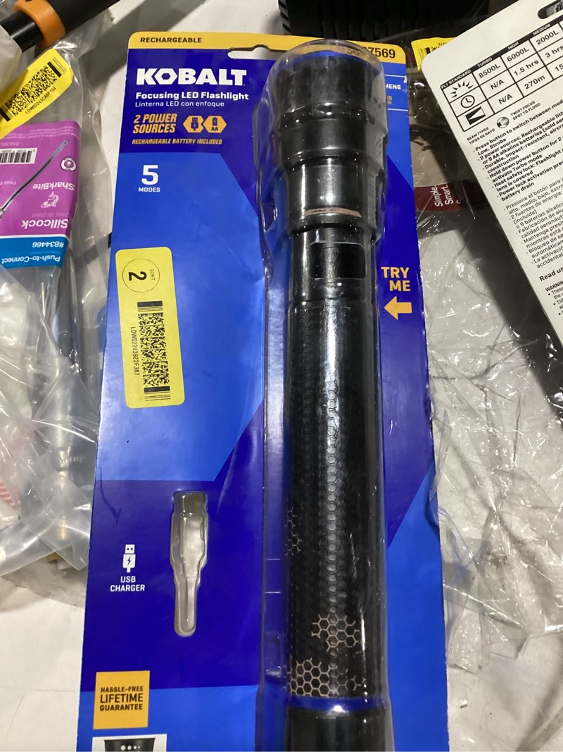 Condition photo showing As Is for **no rechargeable battery** kobalt 6000-lumen 5 modes led flashlight with rechargeable with batteries included