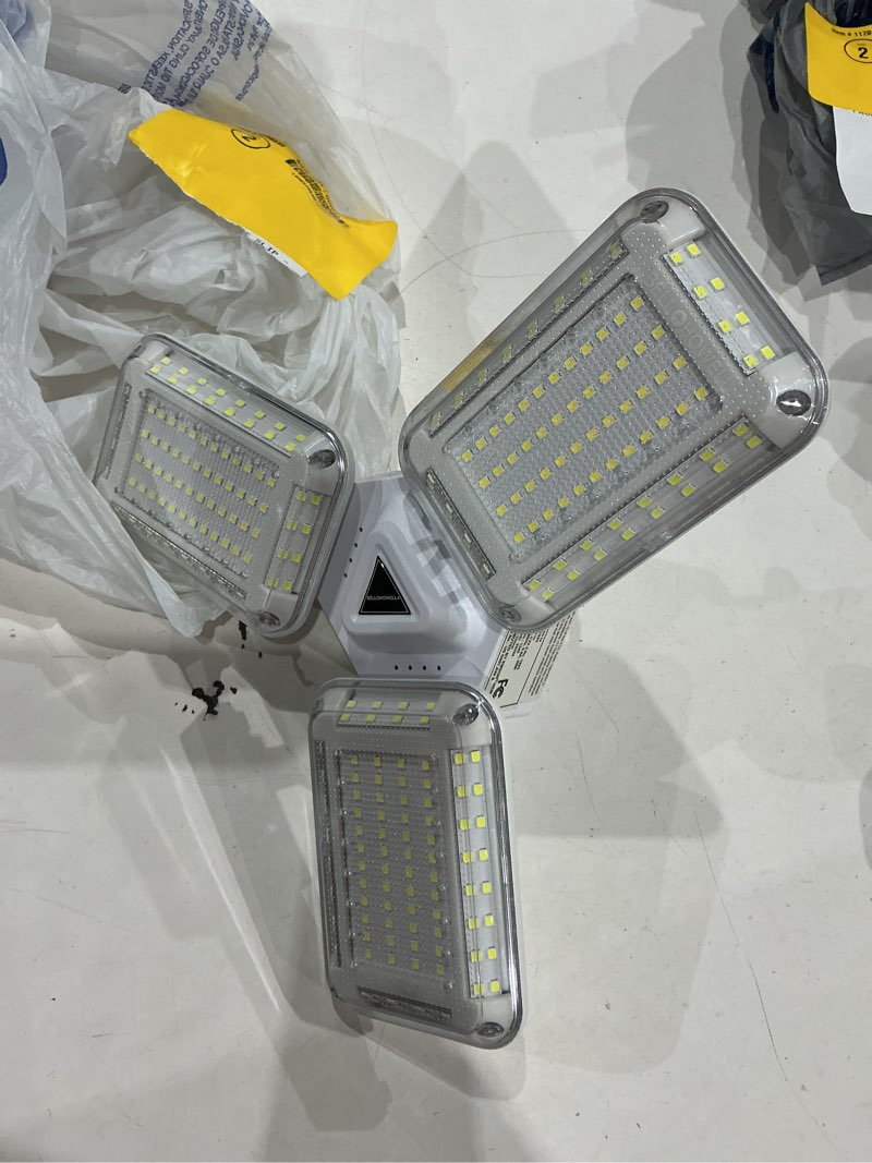 Condition photo showing As Is for bell + howell 5500 -lumens led screw-in ceiling-mounted work light