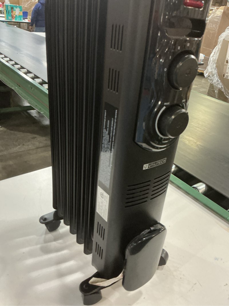 Condition photo showing As Is for bought last week utilitech 1500 -watt oil-filled radiant utility indoor electric space heater with thermostat