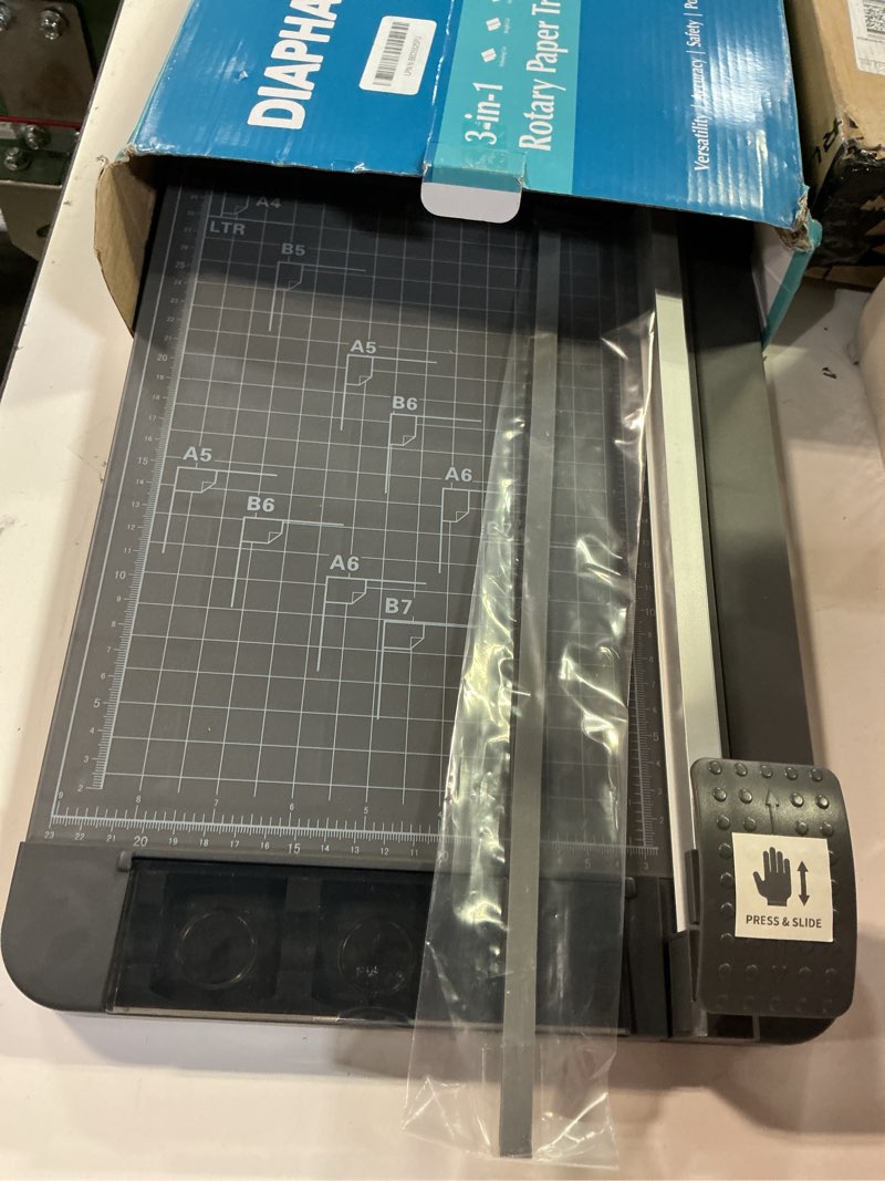 Condition photo showing Good Condition for rotary paper cutter, 3-in-1 paper trimmer, 12 inch cutting length with straight cut/perforating cut/wavy cut, enclosed blades for safe use, ideal for cardstock/paper craft projects