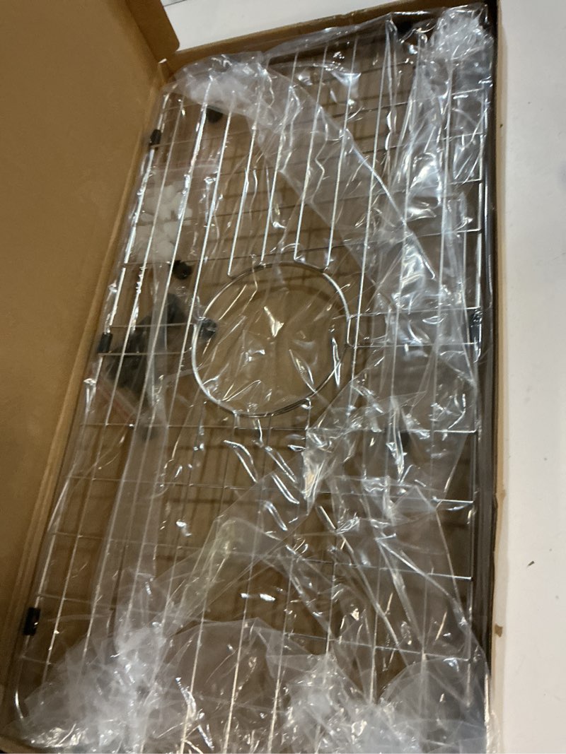 Condition photo showing Good Condition for serene valley sink bottom grid 24-1/8" x 12-5/8", centered drain with corner radius 1-1/2", sink protector nlw2412c