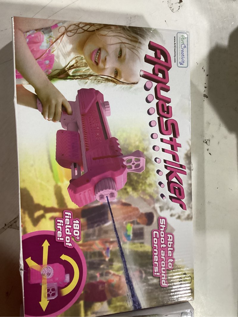 Condition photo showing New/Like New for ArtCreativity AquaStriker Squirt Gun (Pink) - Prank Water Gun Gadget with Adjustable Sideways Shooting Action for Practical Jokes - Gag Water Gun for Kids 8-12 with 20' Range