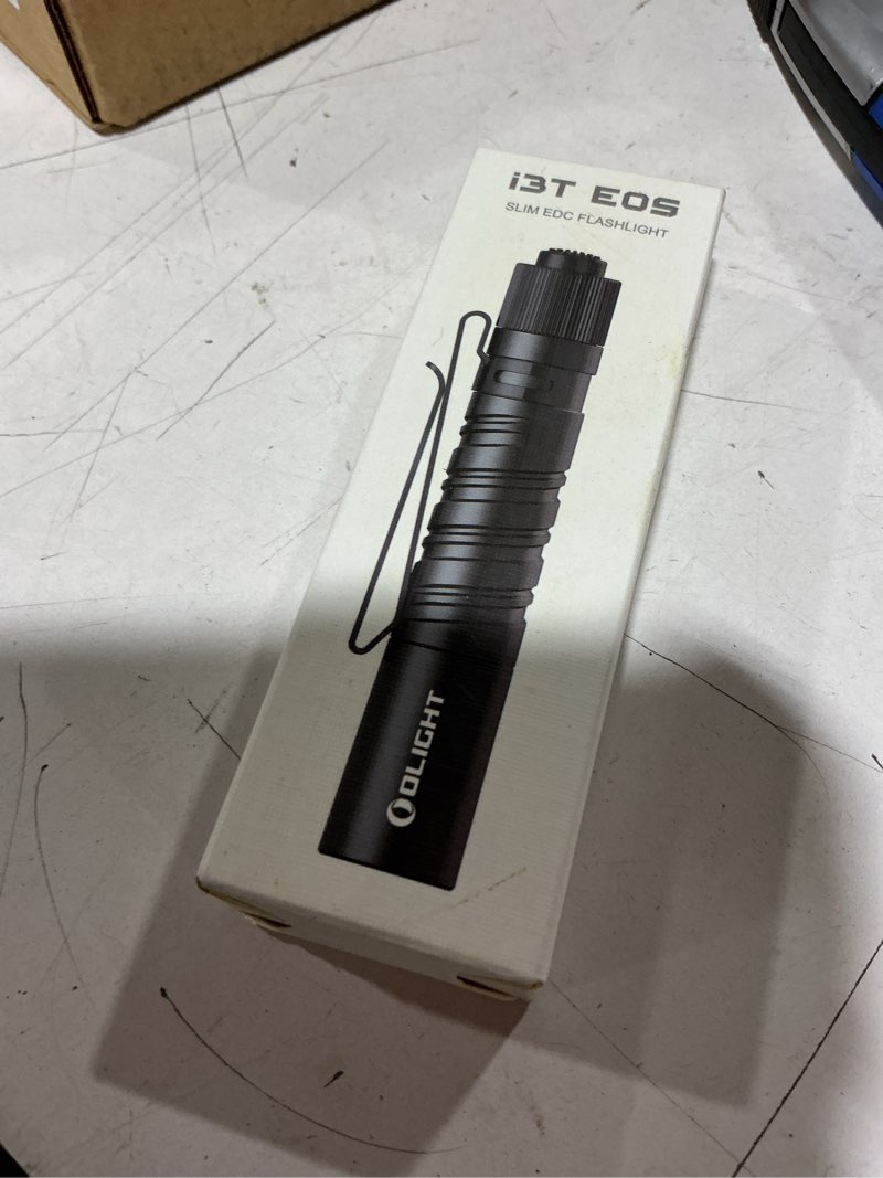 Condition photo showing New/Like New for olight i3t eos 180 lumens dual-output slim edc flashlight for camping and hiking, tail switch flash light with aaa battery (black)