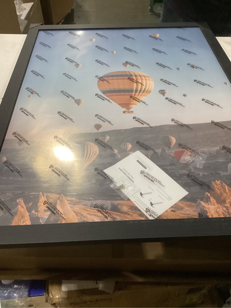 Condition photo showing New/Like New for 24x32 Picture Frame for Wall Display, 24x32 Black Picture Frame with Shatter Resistant Plexiglass, Stable and Sturdy 24 x 32 Poster Frame for Wall Display, Handpicked Gift Collection, 1 Pack