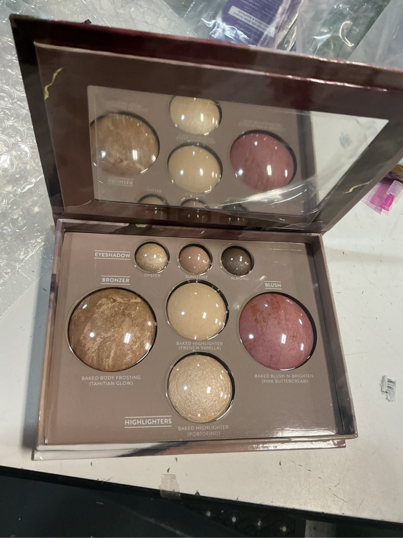 Condition photo showing New/Like New for laura geller new york the best of the best baked palette - full size - includes bronzer  blush  2 highlighters and 3 eyeshadows - travel-friendly