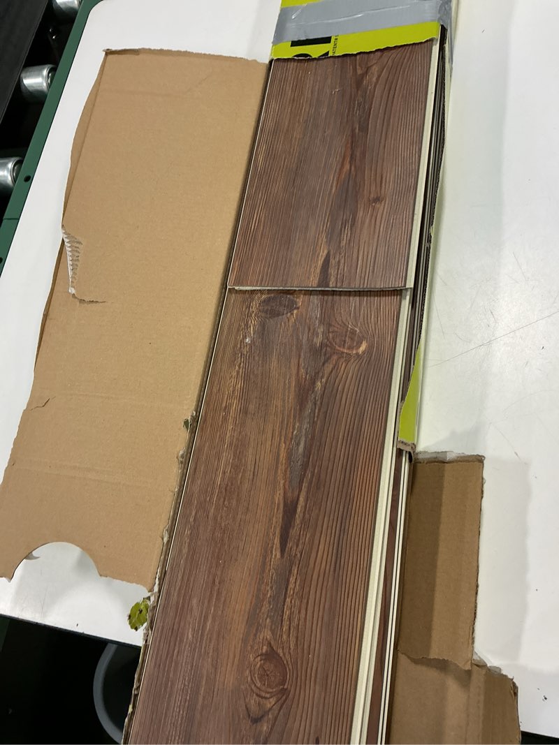Condition photo showing As Is for Peel and Stick Vinyl Flooring 36 Pack 54 Sq.Ft, Waterproof Vinyl Flooring Peel and Stick for Office, Living Room, Bathroom, Kitchen - Unique Design, Easy to Install Floor, Brown 36 x 6 x 0.1 inches Brown 36