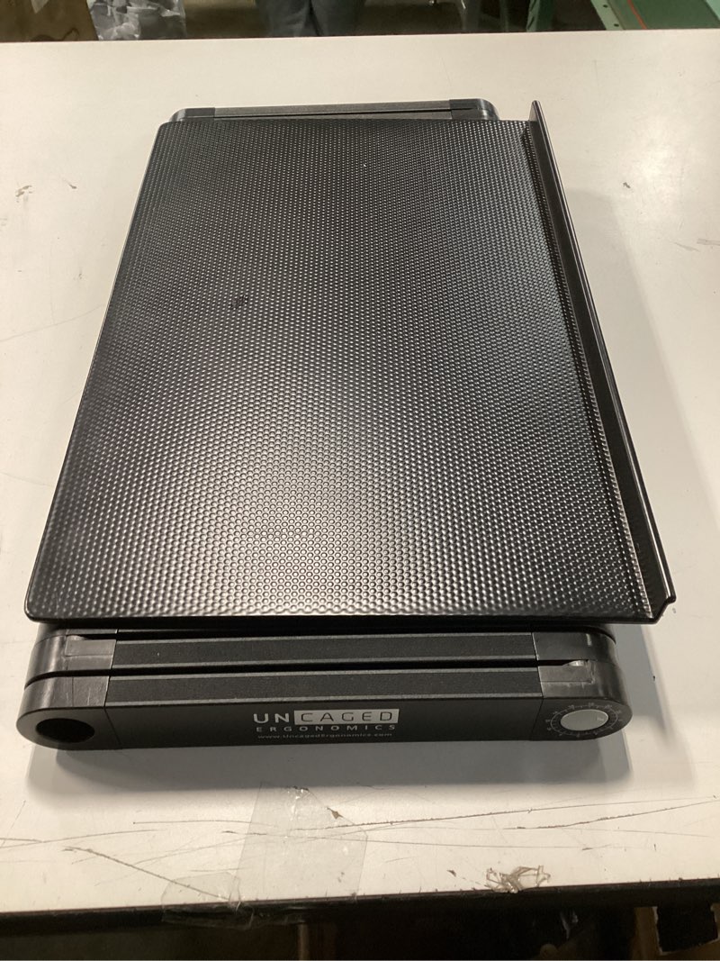 Condition photo showing As Is for Uncaged Ergonomics WorkEZ Adjustable Computer Keyboard Stand for Desk, Keyboard & Mouse Riser, Ergonomic Portable Stand for Desktop, Computer Keypad Riser for Desk Black