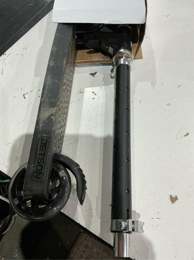 Condition photo showing As Is for jetson jupiter kids 2-wheel light-up kick scooter, led lights on handlebar, stem, wheels & deck, adjustable handlebar, rear brake, easy-folding mechanism, ages 5+ jupiter black