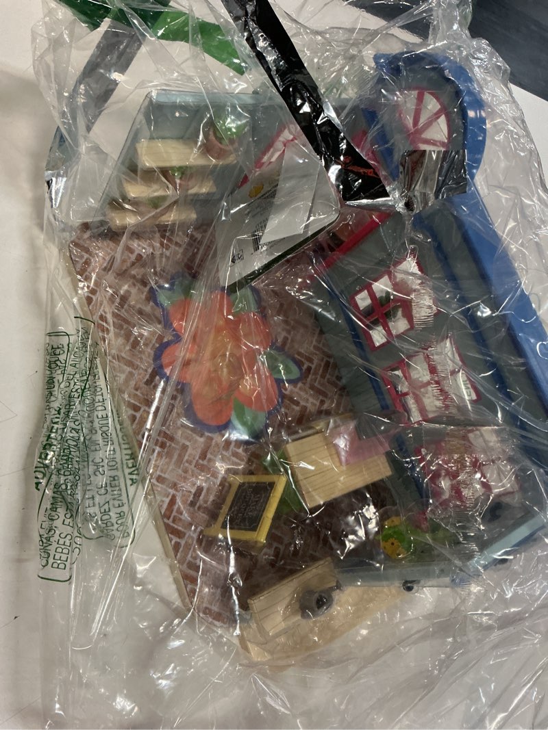 Condition photo showing As Is for (incomplete)honey bee acres in bloom flower shop, complete dollhouse with miniature doll figure, 59 pieces
