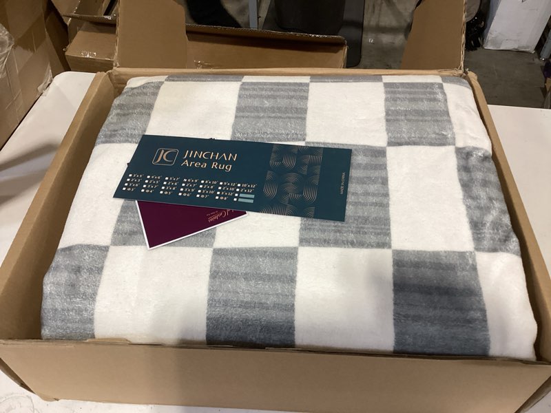 Condition photo showing As Is for jinchan 6x9 checkered area rugs for kids room - machine washable soft rug modern geometric lattice non-slip carpet for nursery playroom classroom living room bedroom dining room home office grey 6' x 9' (rectangular) checkered grey