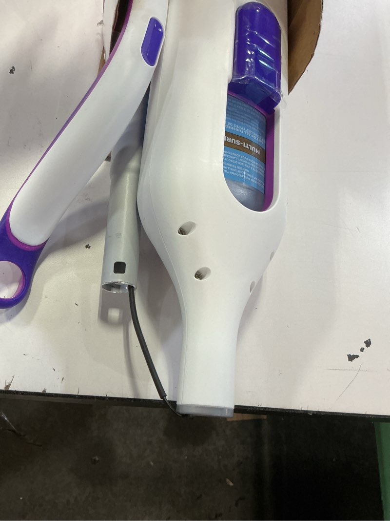 Condition photo showing As Is for swiffer powermop multi-surface mop kit for floor cleaning, includes powermop, 2 mopping pad refills, 1 cleaning solution with fresh scent and 2 batteries purple and white