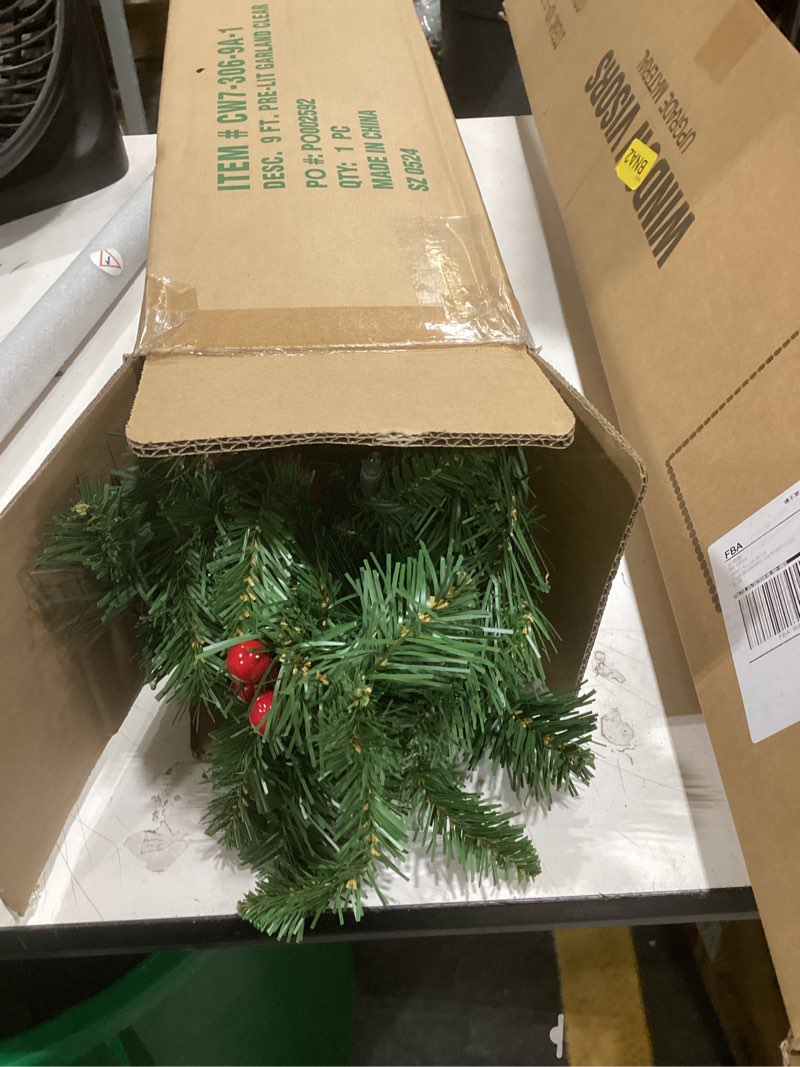 Condition photo showing New/Like New for national tree company 9 ft pre-lit crestwood spruce artificial christmas garland, christmas decoration with glitter, pinecones, red berries, 50 clear lights, 180 tips, green plug in tree