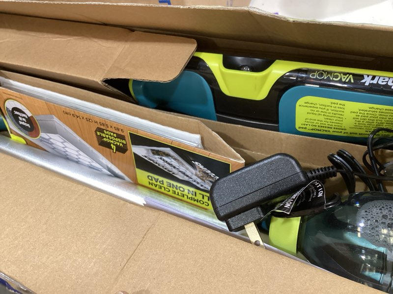 Condition photo showing As Is for shark vacmop reveal new cordless hard floor cleaner, vacuum & spray mop, powerful suction, lightweight, illumination light, includes 4 disposable pads, 12oz pet multi-surface cleaning solution, vm401
