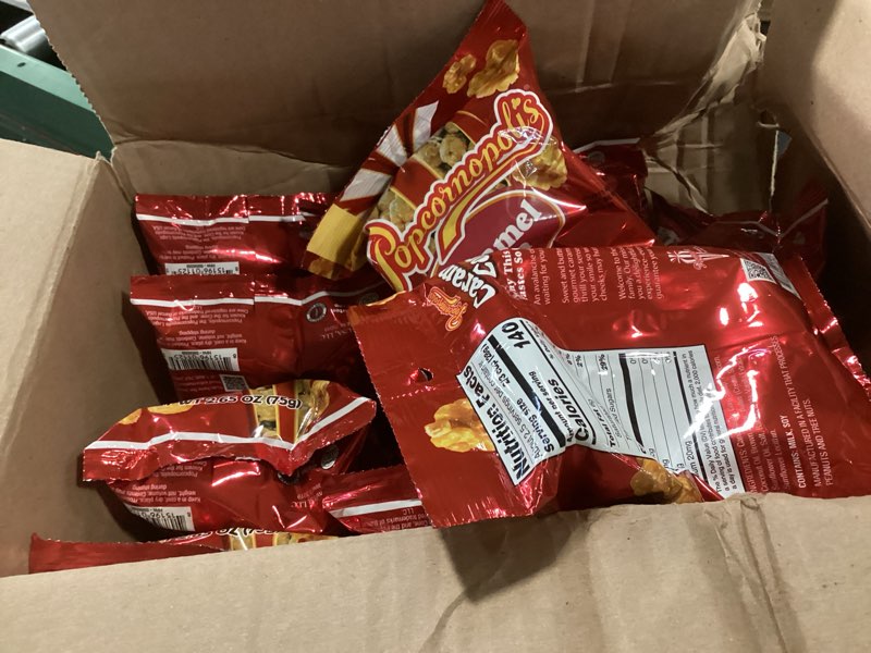 Condition photo showing New/Like New for ( best before: 06/18/2026)Popcornopolis 12 ct, 2.65 oz Case, Caramel Flavored Indulgent Popcorn