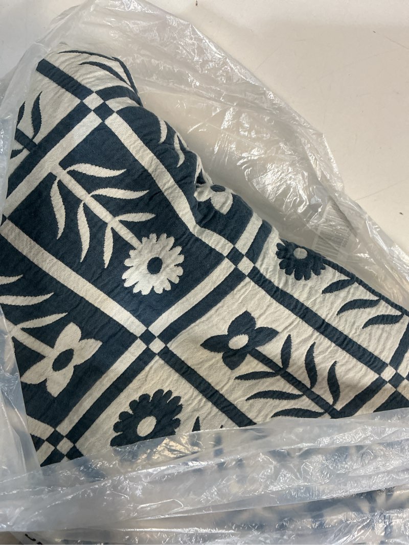 Condition photo showing As Is for blue and white flower blanket king/cal king