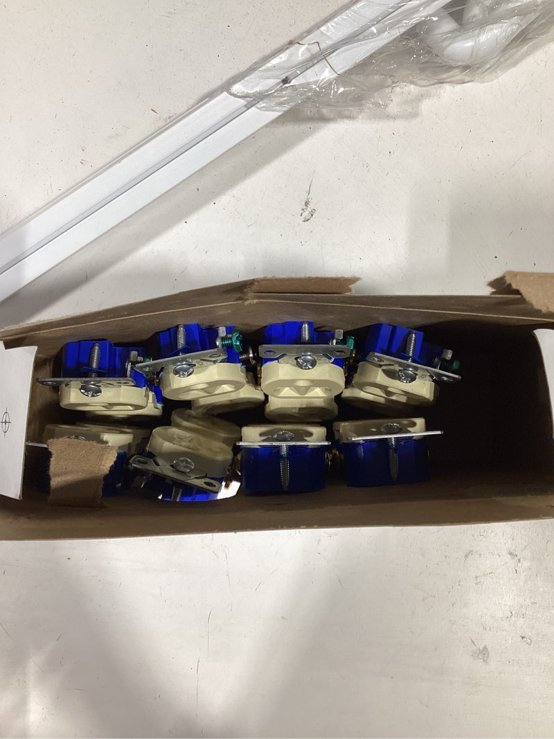 Condition photo showing As Is for eaton 15-amp 125-volt residential duplex outlet, ivory (10-pack)
