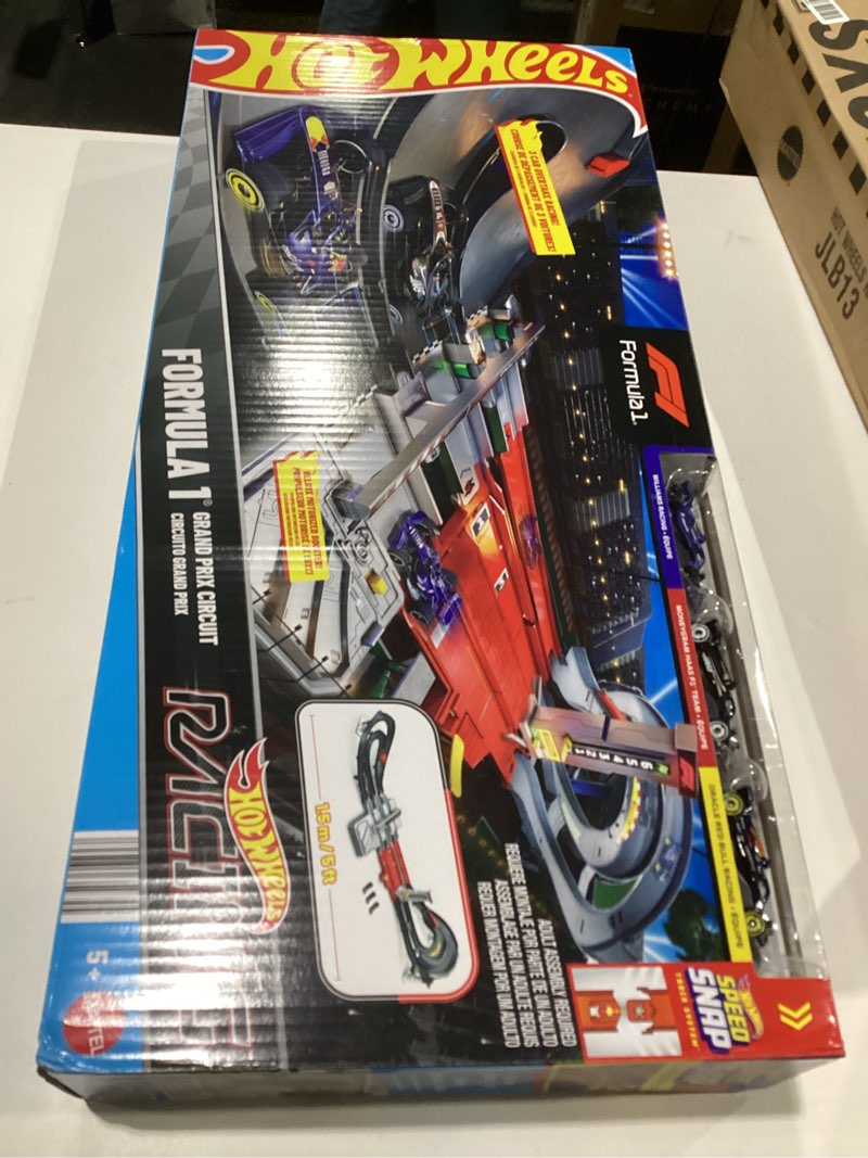 Condition photo showing Good Condition for hot wheels toy car track set, formula 1 grand prix circuit track set with 3 1:64 scale die-cast toy cars, two modes of racing with a motorized booster