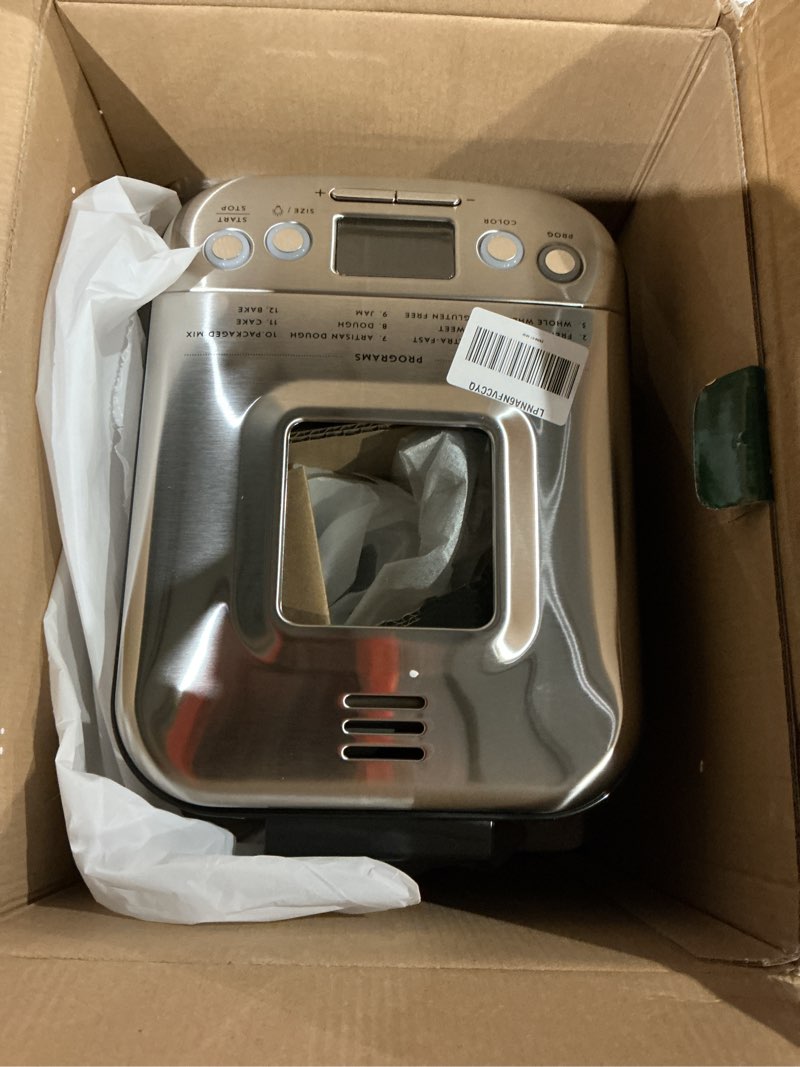Condition photo showing As Is for cuisinart bread maker machine, stainless steel automatic bread machine with 12 menu options, 3 loaf sizes up to 2 lb., 3 crust colors, removable nonstick baking pan & kneading paddle, cbk-110nas
