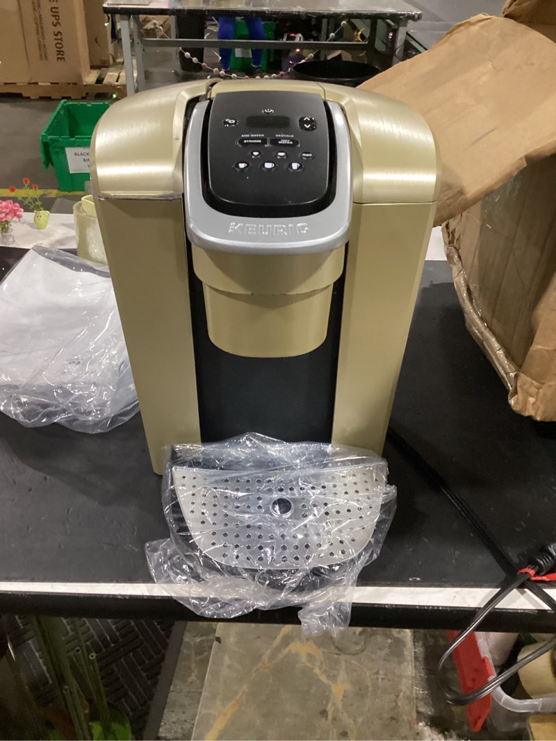 Condition photo showing As Is for keurig k-elite single serve k-cup pod coffee maker, with strength and temperature control, iced coffee capability, 8 to 12oz brew size, programmable, brushed gold