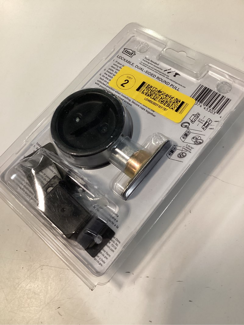 Condition photo showing As Is for m-d 2.375-in matte black lockable pocket door pull