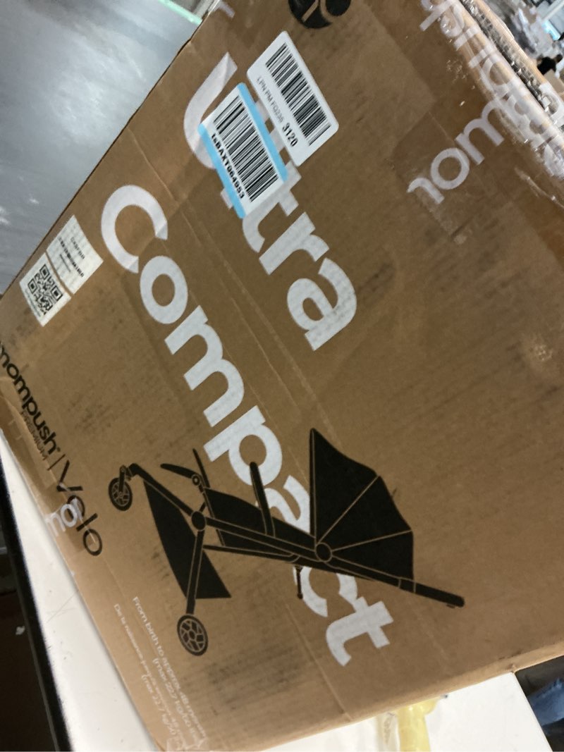 Condition photo showing New/Like New for mompush velo lightweight travel stroller, compact & airplane-friendly for baby and toddler, lie-flat seat, one-hand fold, with leather bumper bar, shoulder strap, raincover, storage bag & cup holder stroller charcoal black