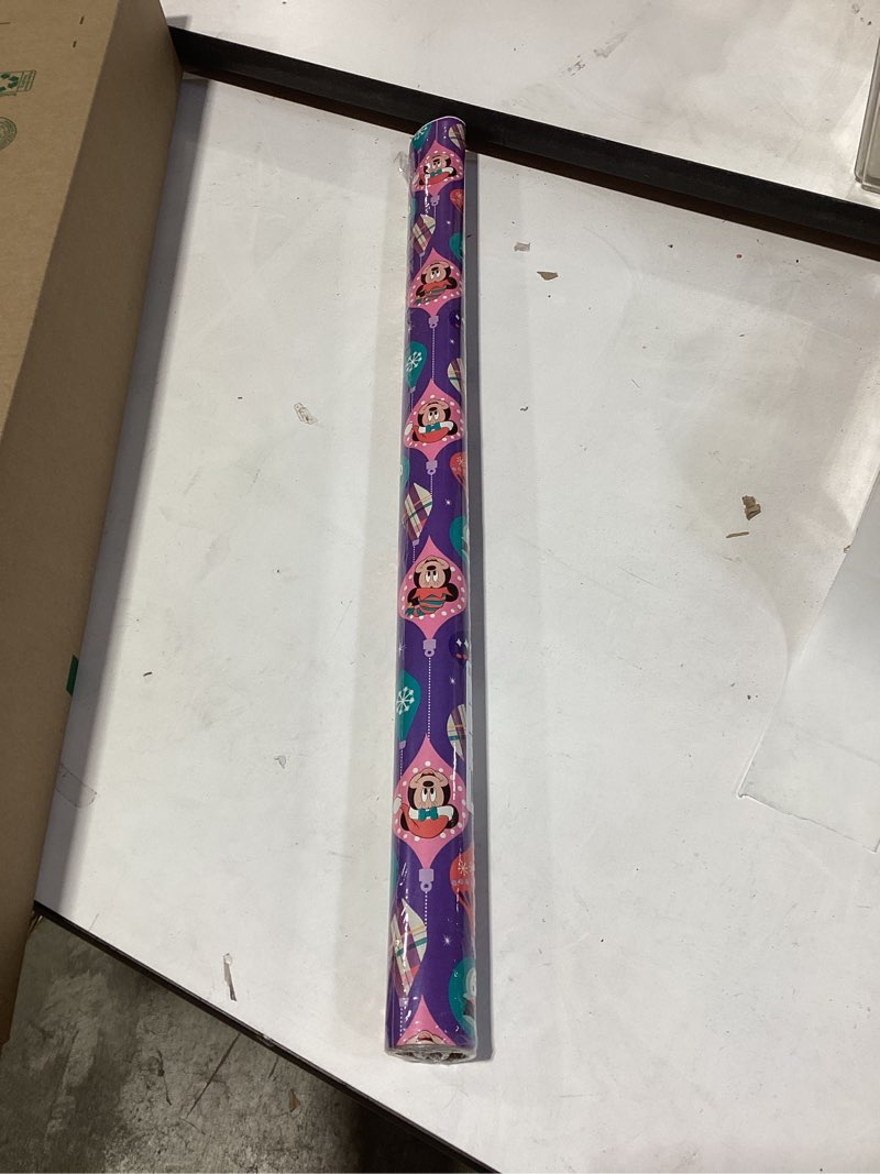 Condition photo showing Good Condition for American Greetings Disney Christmas Wrapping Paper Rolls with Minnie Mouse, Pink and Purple Holiday Gift Wrap (40 sq. ft., 1 Reversible Roll-30 in. x 16 ft.) Minnie, Mickey, Snowmen, Ornaments Minnie Mouse and Friends