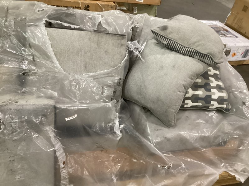 Condition photo showing As Is for Signature Design by Ashley Avenal Park Casual Sofa with 5 Toss Pillows, Light Gray