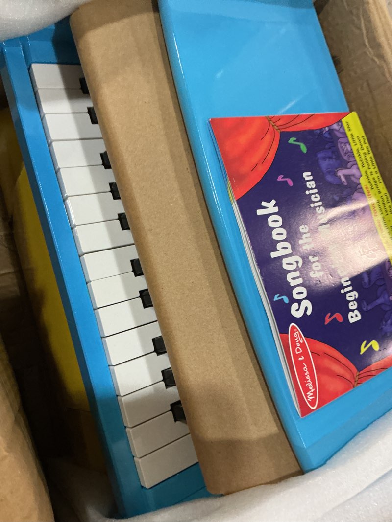 Condition photo showing New/Like New for melissa & doug learn-to-play piano with 25 keys and color-coded songbook - blue