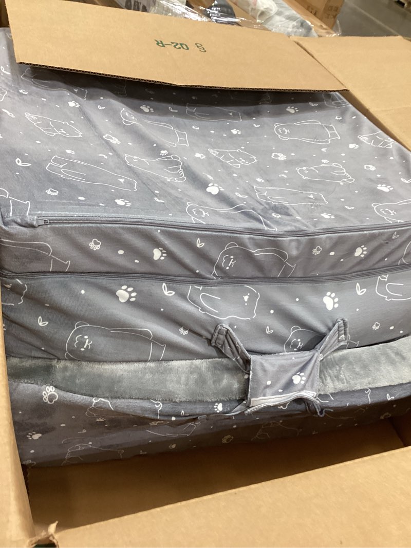 Condition photo showing As Is for portable toddler travel bed – foldable soft foam floor crib with washable cover, built-in safety rails, no assembly, compact for travel & home use, grey light grey