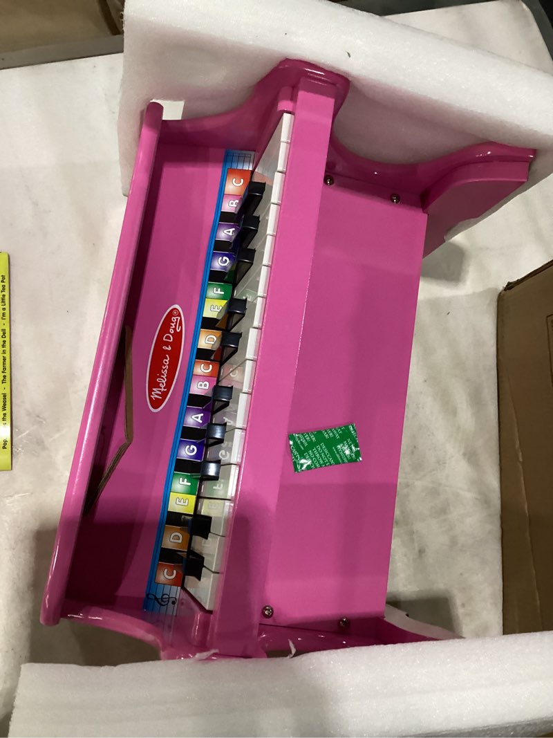 Condition photo showing Good Condition for melissa & doug learn-to-play pink piano with 25 keys and color-coded songbook