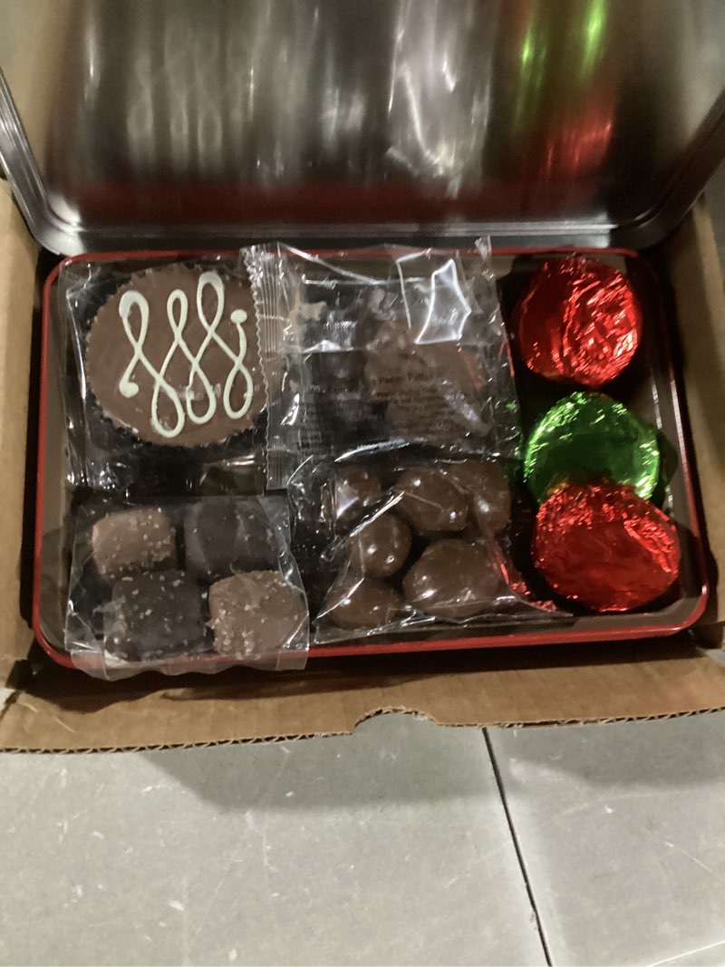 Condition photo showing Good Condition for A Gift Inside Holiday Chocolate Christmas Collection Gift Tin