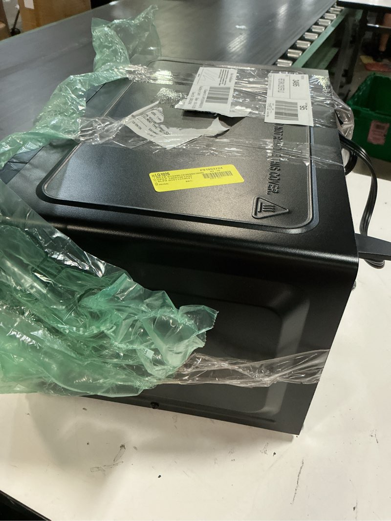 Condition photo showing As Is for mainstays ms8436127995-01 0.7 cu ft countertop microwave oven, 700 watts, black