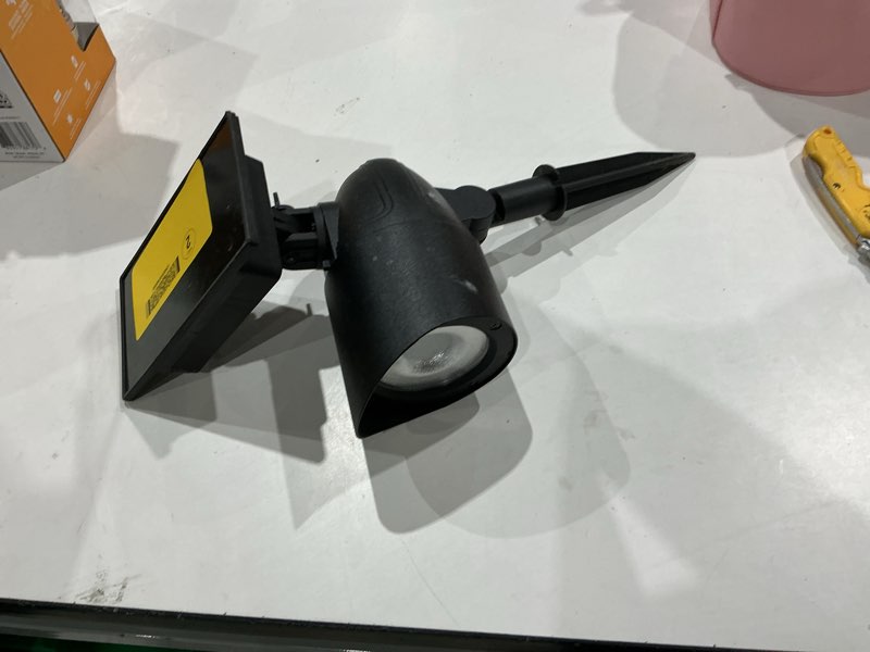 Condition photo showing As Is for harbor breeze 30 -lumens black solar led spot light item 