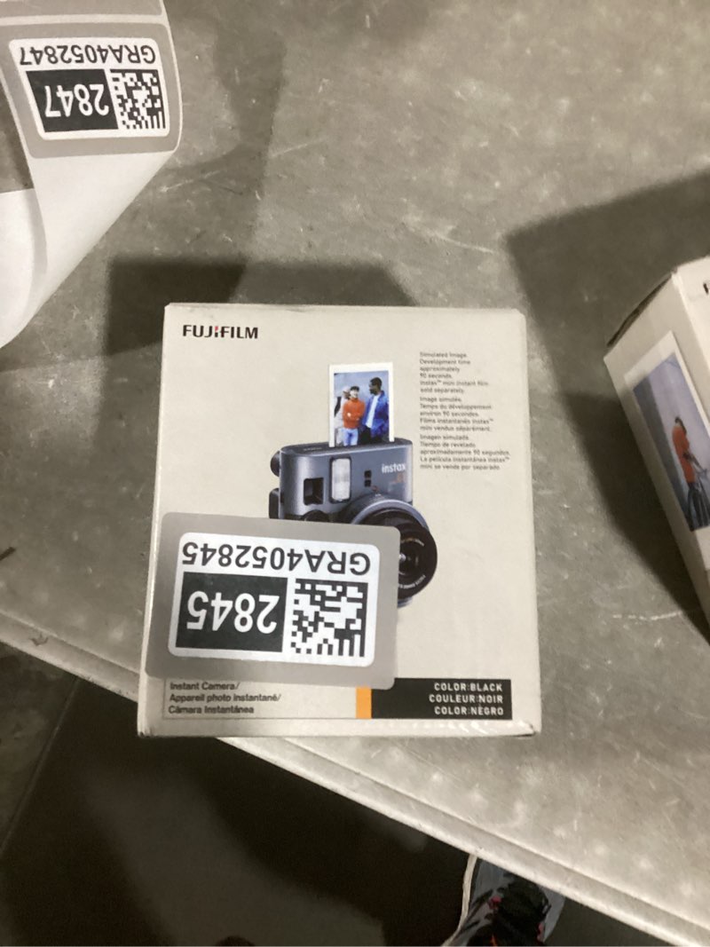 Condition photo showing Good Condition for fujifilm instax mini 41 instant camera vintage black. + fujifilm value pack (40 sheets) + shutter accessories bundle, includes vintage style compatible carrying case, black photo album 64 pockets