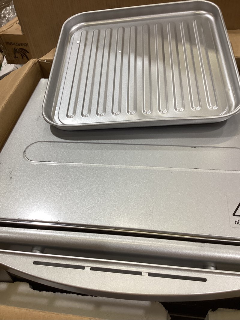 Condition photo showing As Is for panasonic flashxpress silver toaster oven in silver