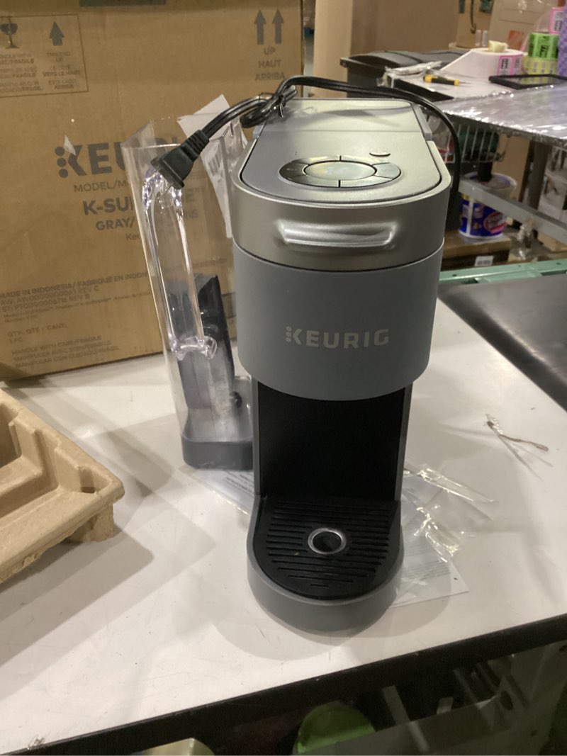 Condition photo showing As Is for not tested ****keurig k-supreme single serve k-cup pod coffee maker, multistream technology, 4 brew sizes, 66oz dual-position removable reservoir, gray gray coffee maker