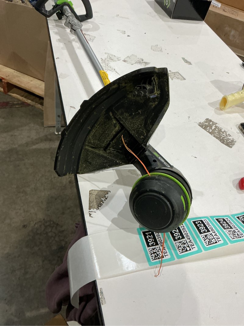 Condition photo showing As Is for ego powerload 56-volt 15-in telescopic shaft battery string trimmer 2.5 ah (battery included) (charger included)