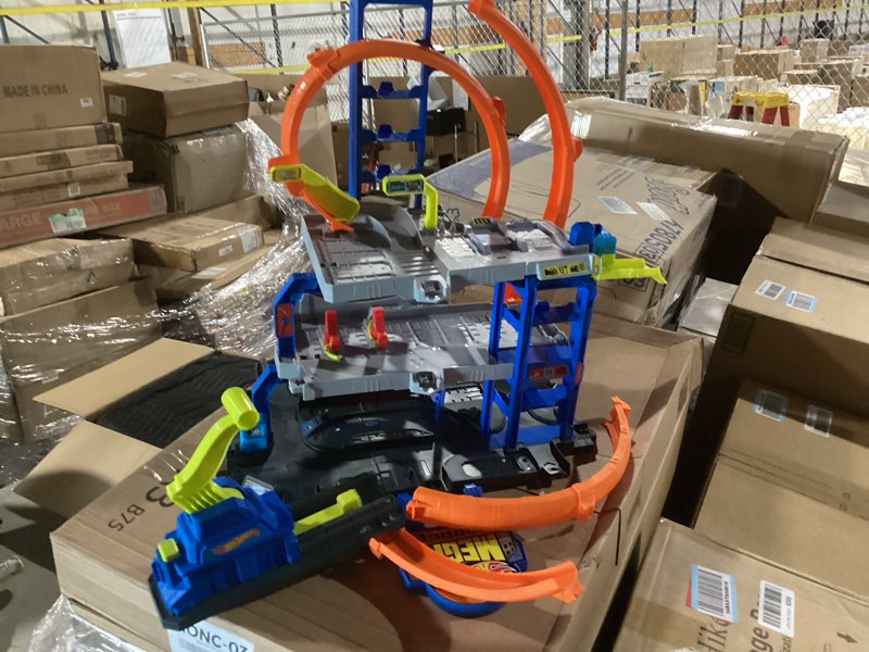 Condition photo showing Good Condition for hot wheels toy car track set with die-cast car & helicopter, 2 loops, storage for 36 1:64 scale vehicles, speed snap adapters, mega loop garage