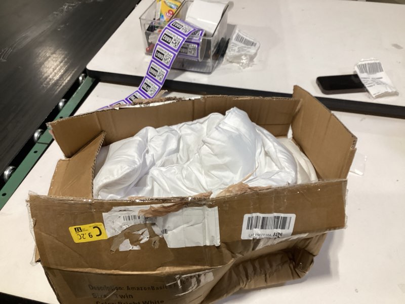 Condition photo showing As Is for Amazon Basics Soft, Lightweight Twin Size Comforter Set, All-Season Down-Alternative 2-Piece Bedding Set, Pinch Pleat Design with Piped Edges, Twin/TwinXL, Bright White Bright White Twin/Twin XL