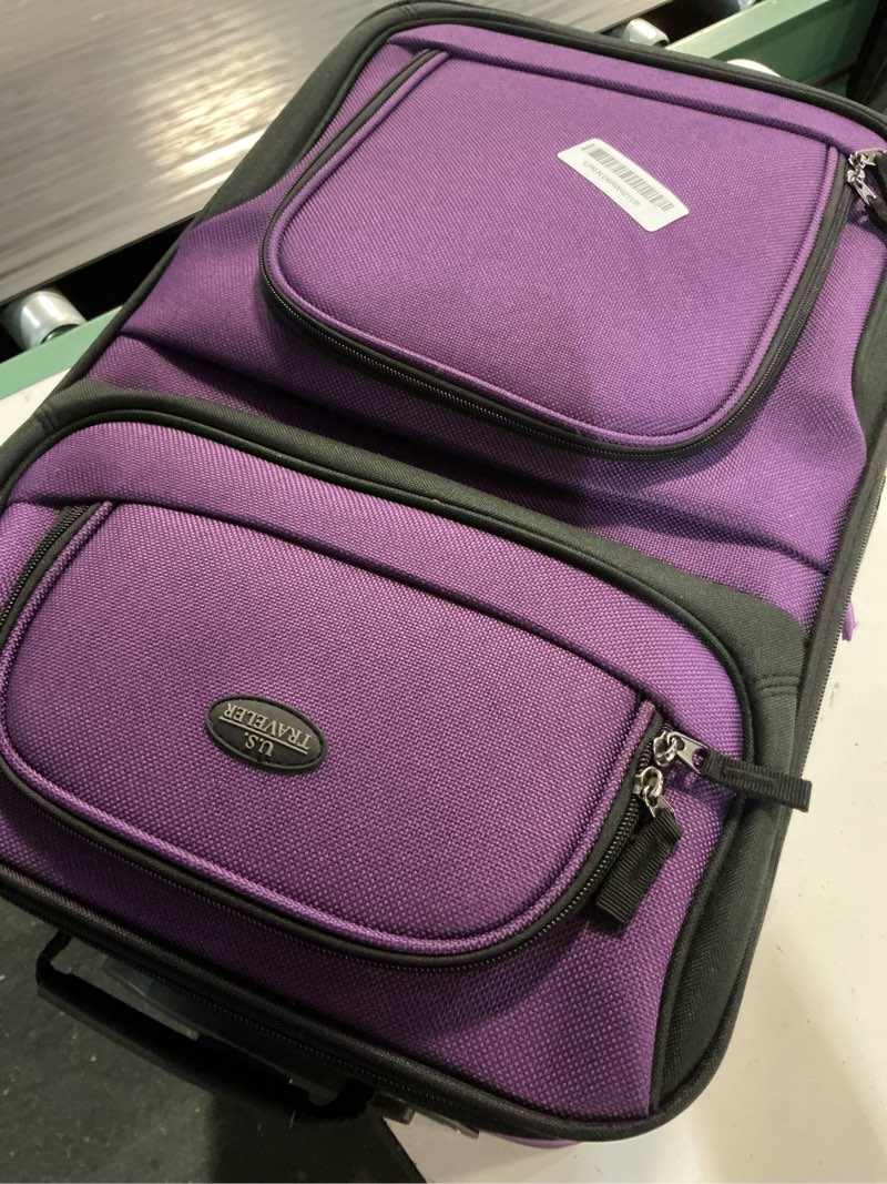 Condition photo showing As Is for u.s. traveler rio lightweight softside rolling carry-on suitcase, 2-wheel single, purple purple 21"